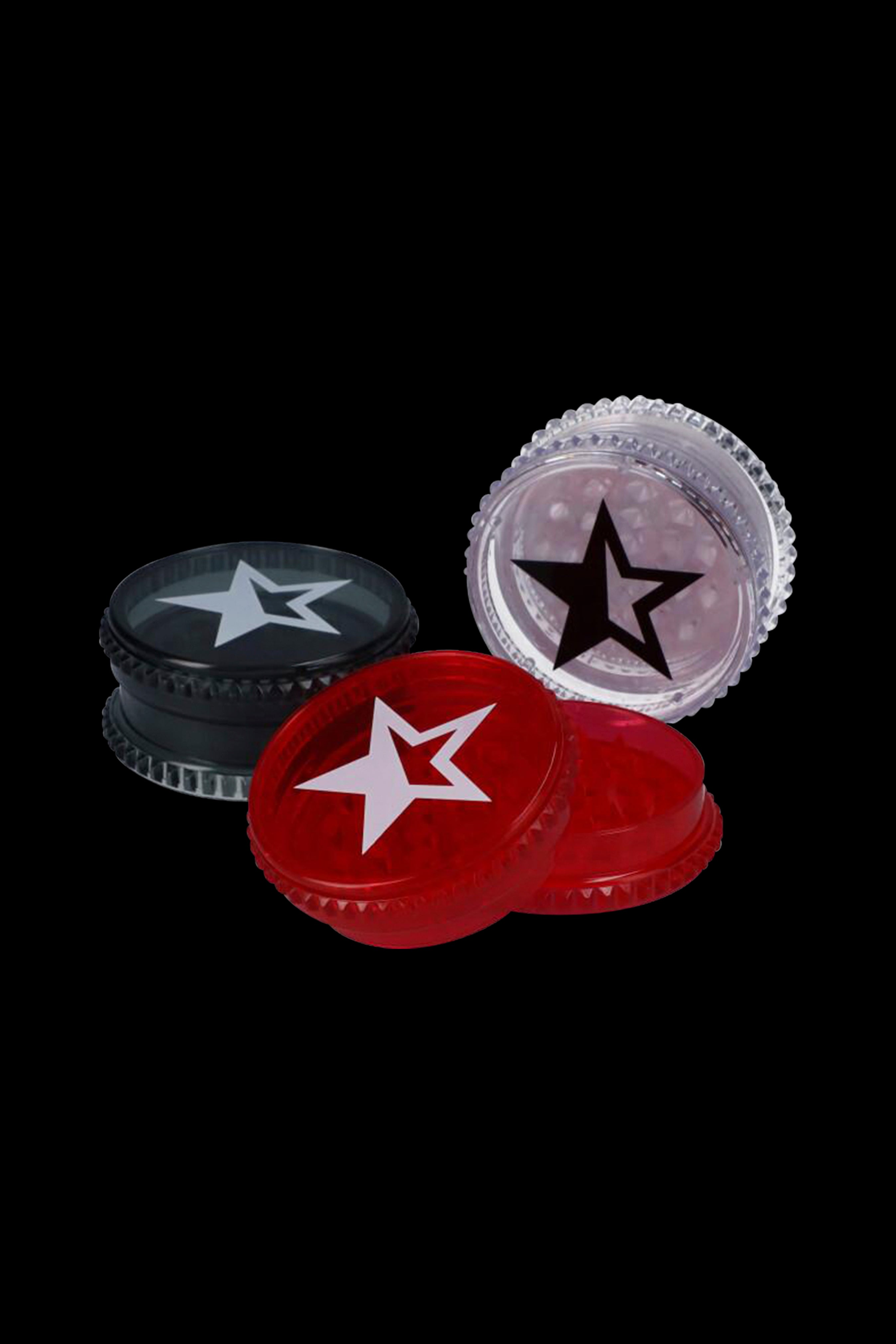 Three small, star-branded containers for cannabis concentrates against a black background.