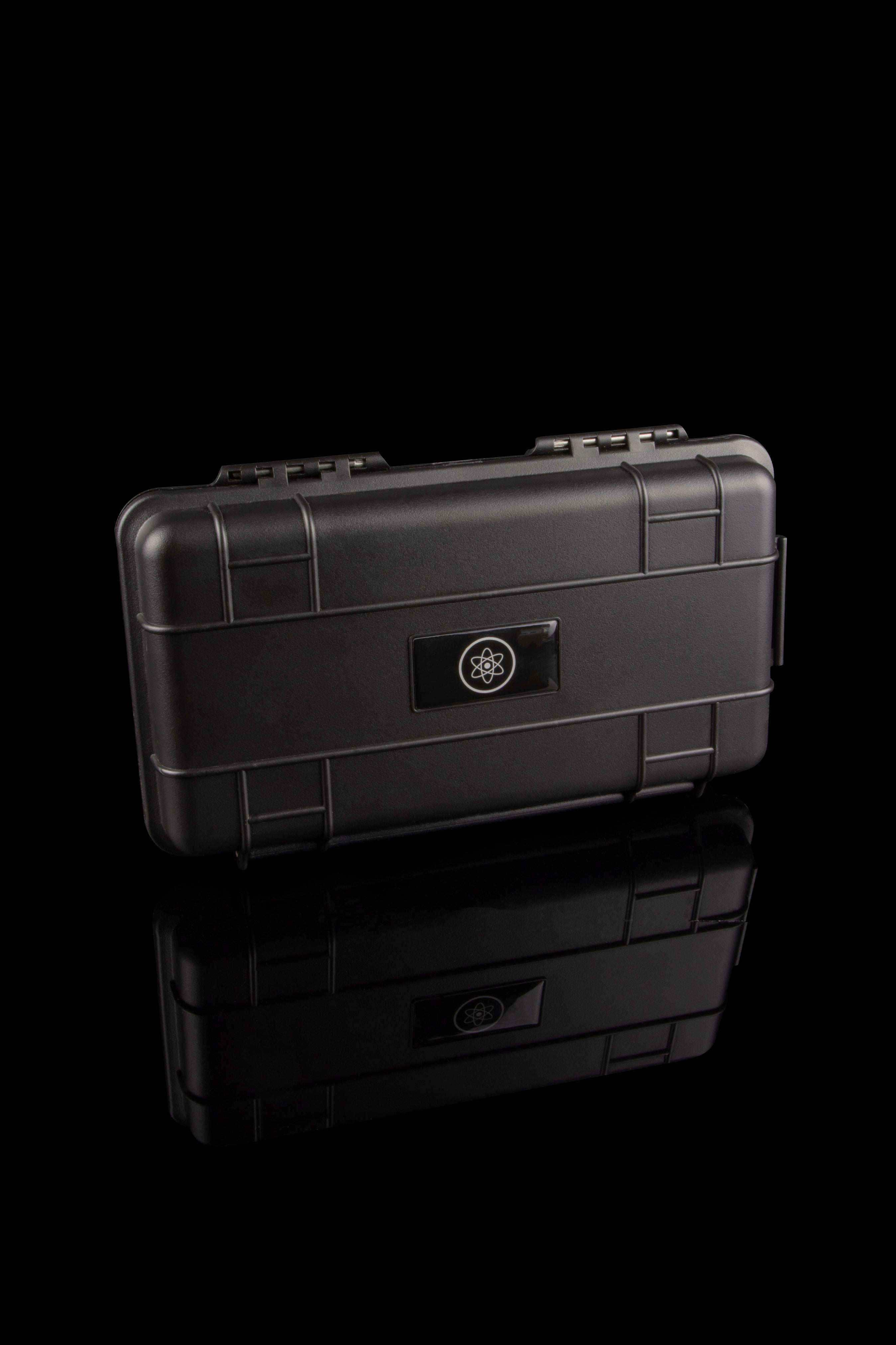Black, airtight case with a stylized atom logo, stacked on a reflective surface, likely for cannabis storage.