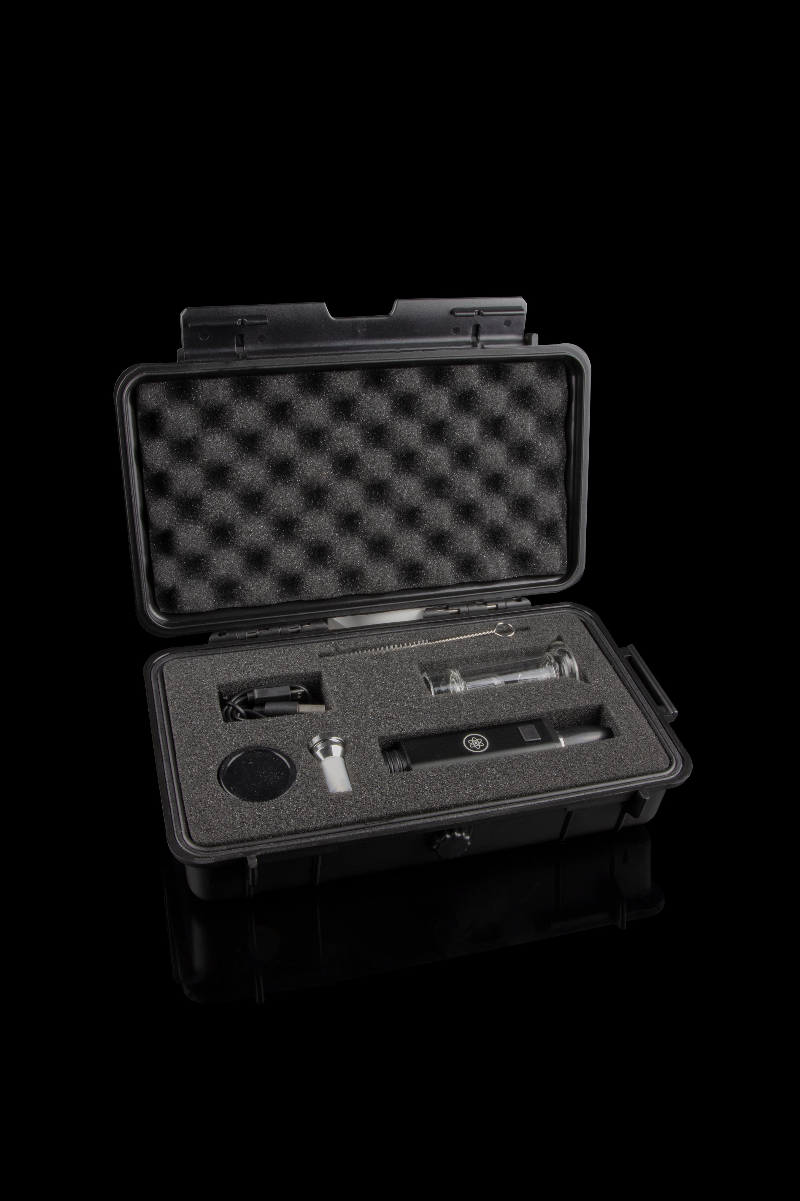 Open black case containing a cannabis oil vaporizer pen and accessories, lined with foam insert.