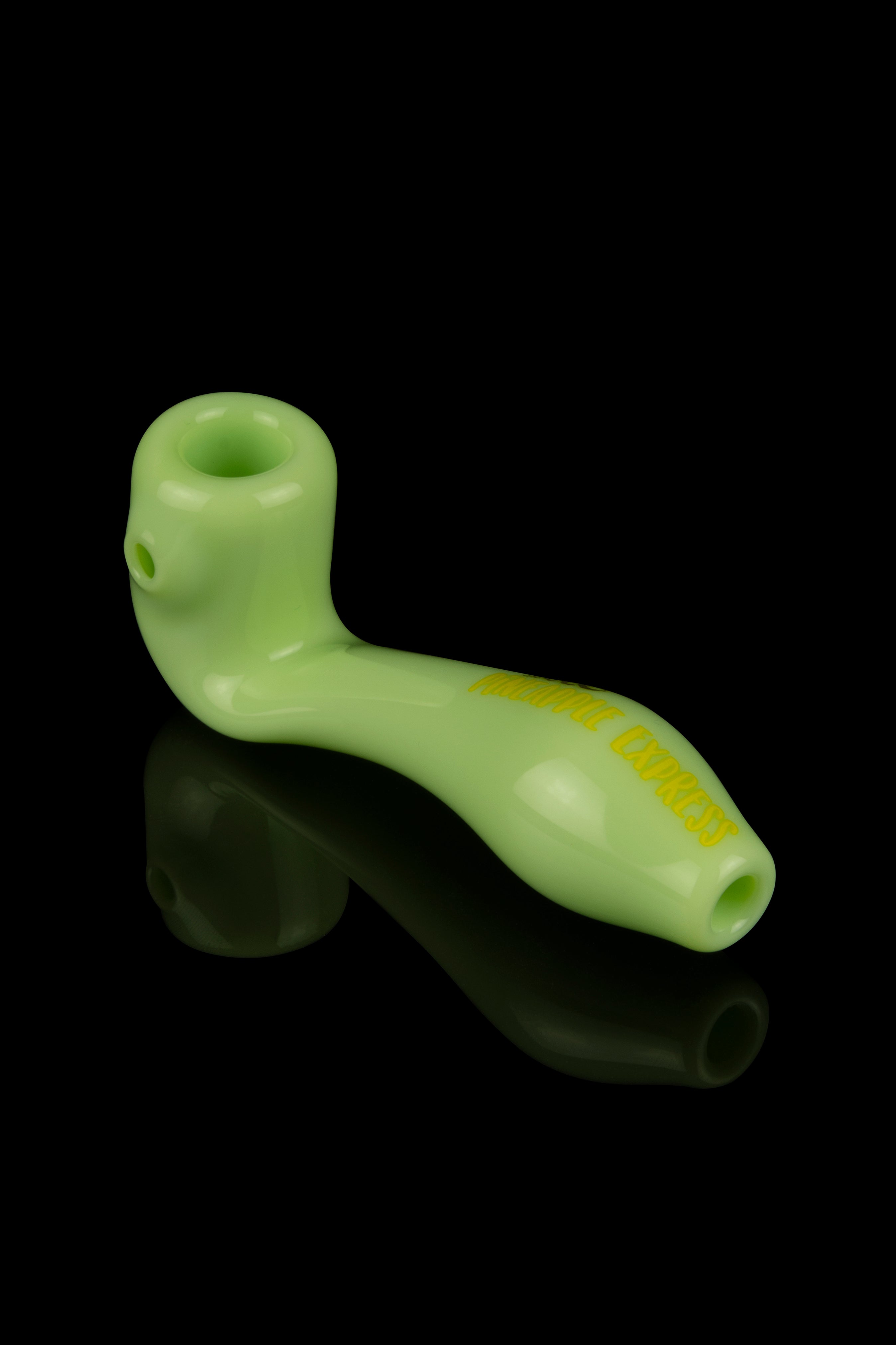 Lime green glass pipe with embossed text, reflecting on a black surface.