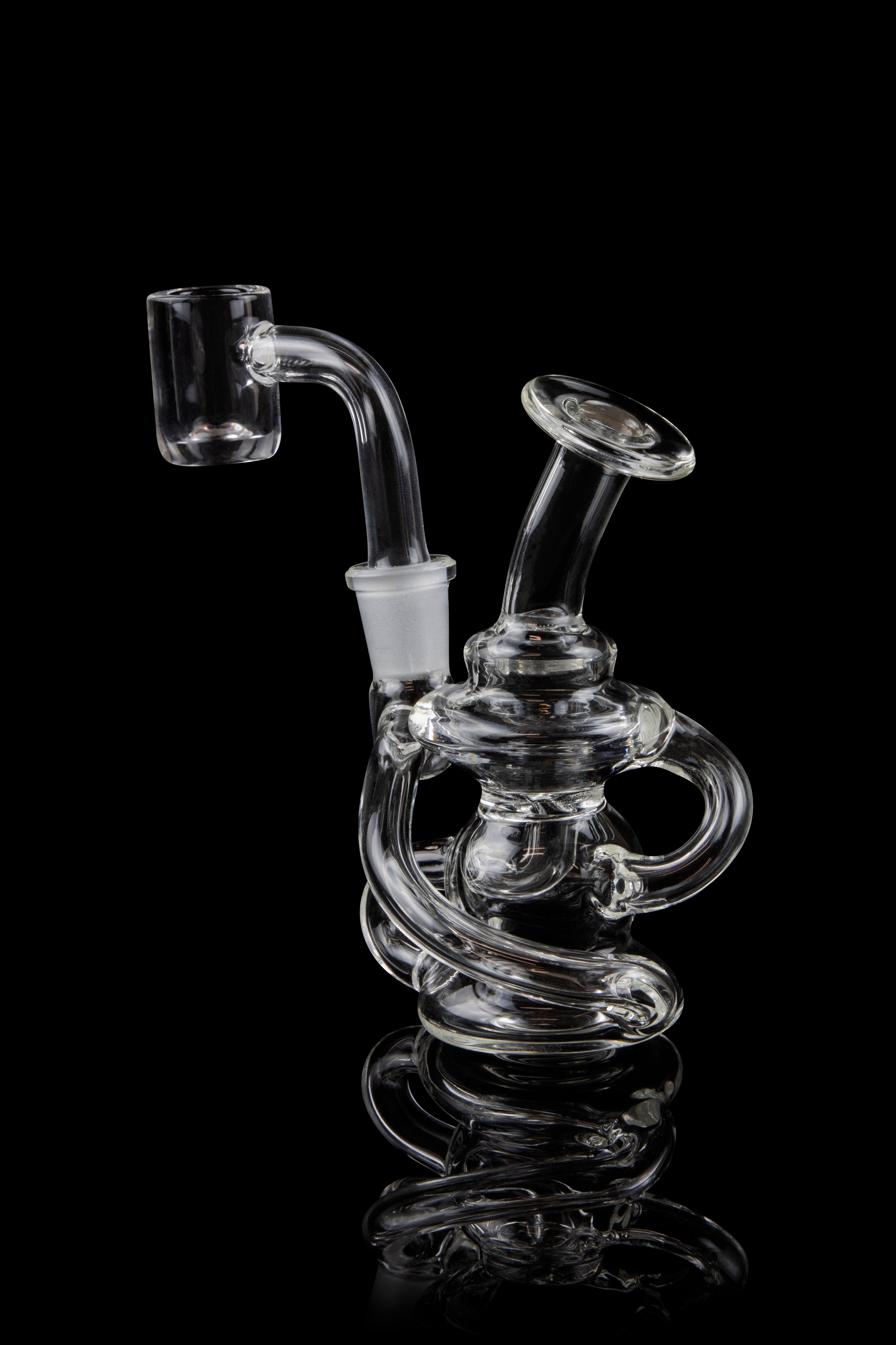 Clear glass dab rig with intricate looping design, against a black background.