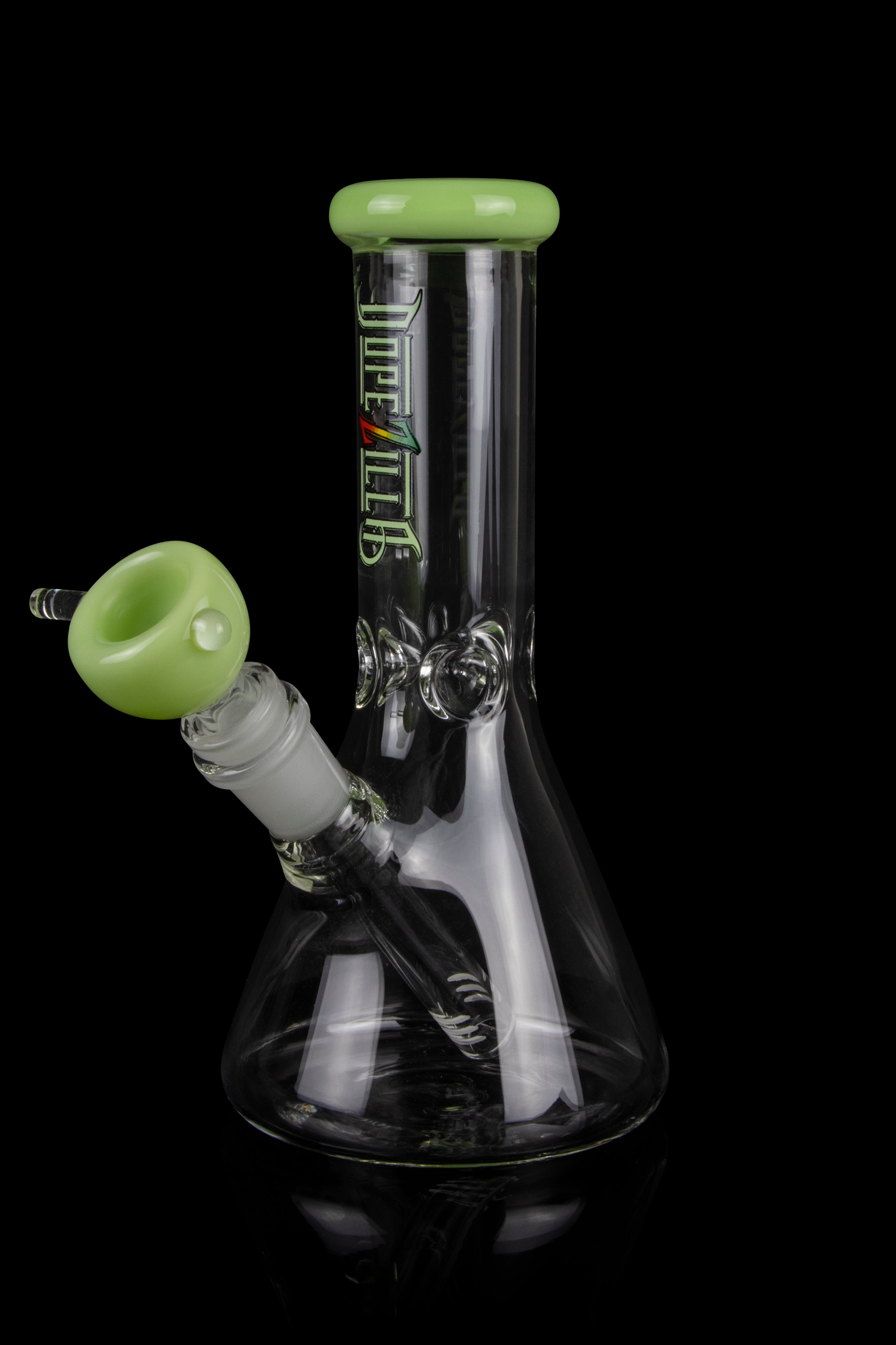 A green and black glass bong with a removable bowl, isolated on a black background.