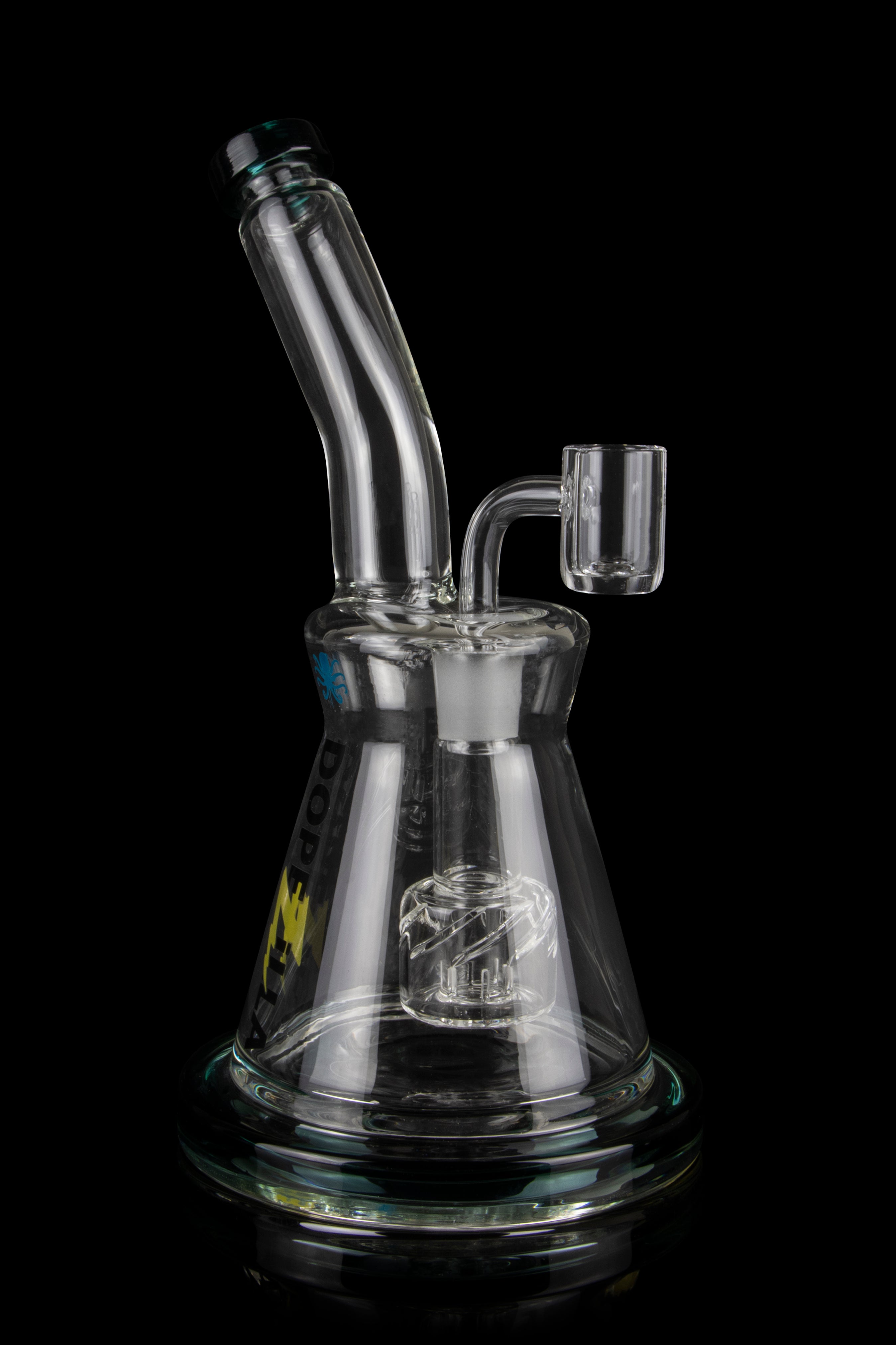 Clear glass dab rig with intricate percolator and quartz banger, isolated on a black background.