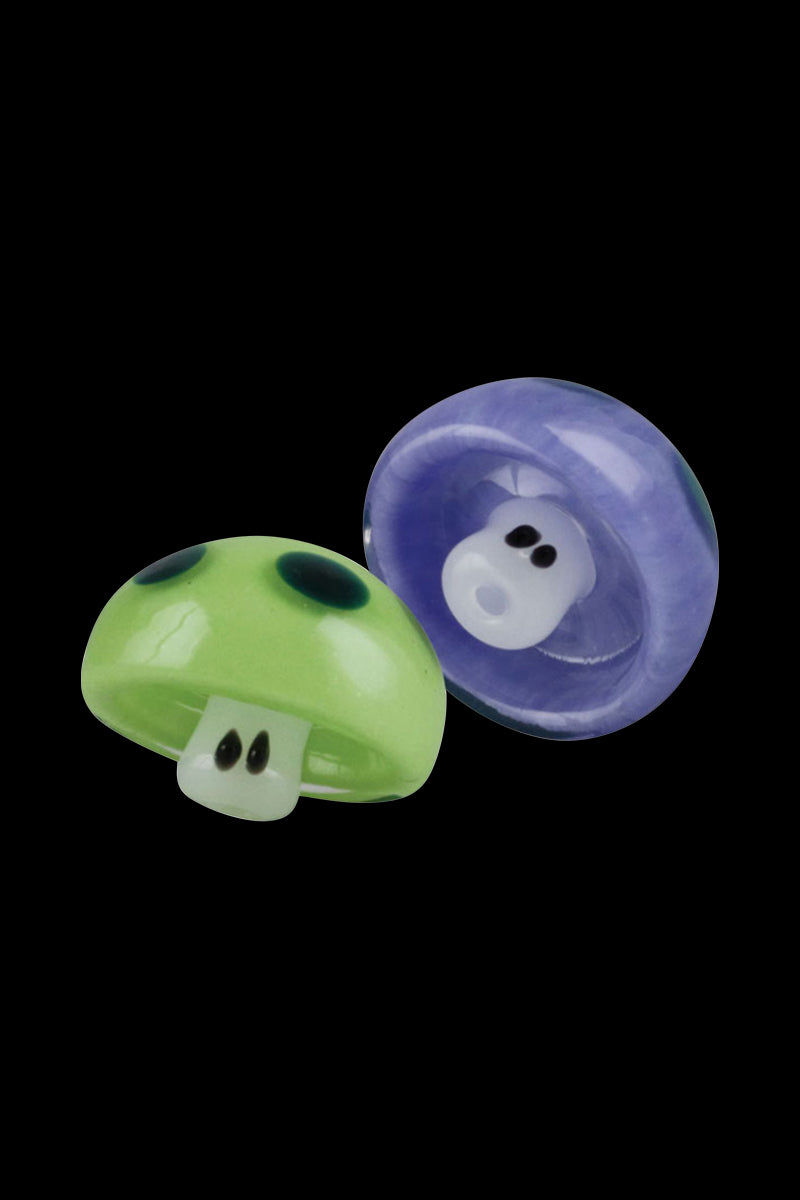 A detailed, angled view of the Mushroom Fungi Glass Carb Cap, showcasing its smooth, reflective surface against a dark background.