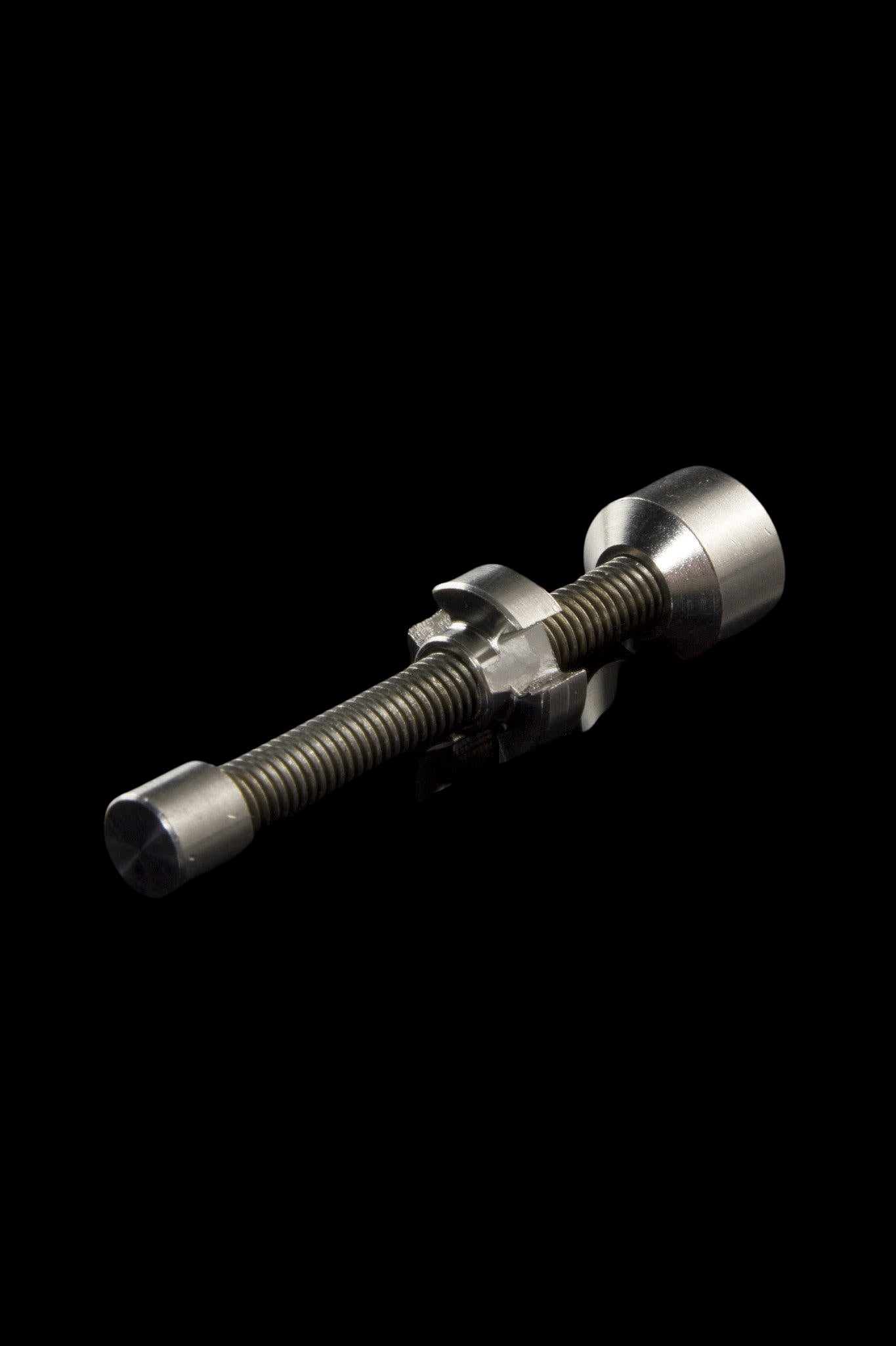 A slightly angled view of the DabWorthy Adjustable Titanium Nail, showcasing its metallic sheen and minimalist design.