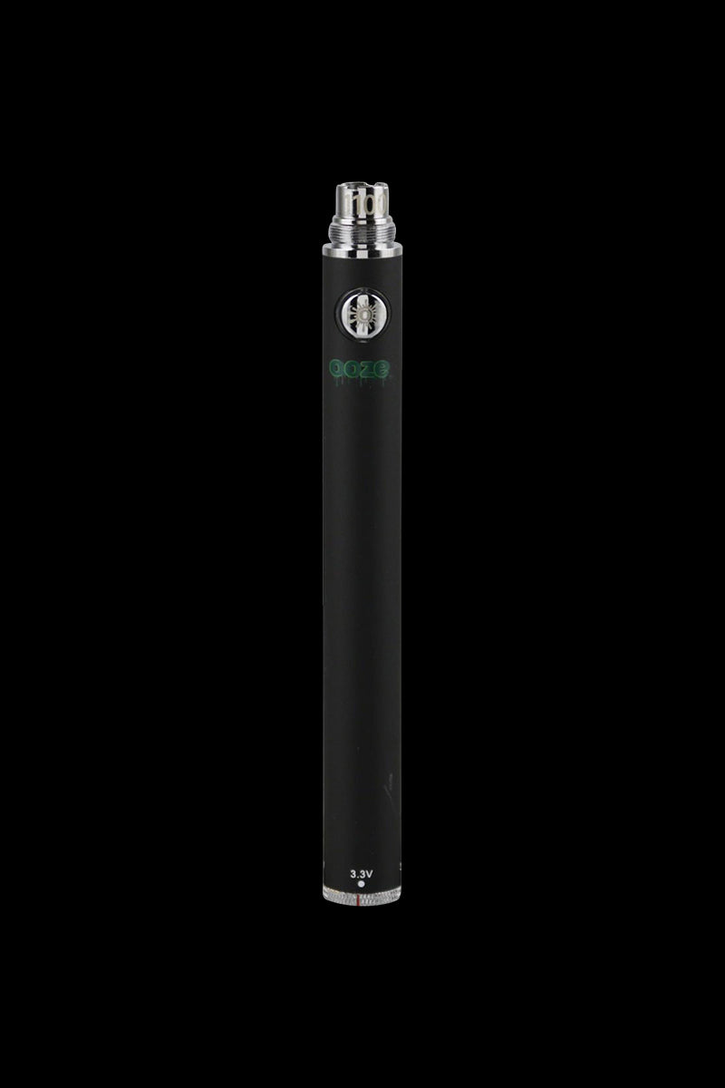 Centered vertical studio shot of an Ooze Adjustable Twist 1100mAh Batteries - 5 Pack pen-style battery in matte black against a solid black background, showing the top threading, circular power button, and 3.3V marking at the base.