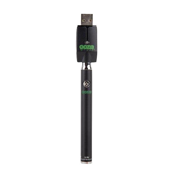Straight-on view of the black Ooze Slim Twist Battery with Charger standing upright on a white background, showing the USB charger head and green logo.