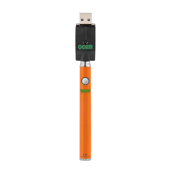 Center-aligned product shot of the Ooze Slim Twist Battery with Charger showing an orange slim battery attached to a black USB charger on a white background.
