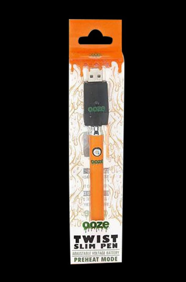 Center-aligned product shot of the Ooze Slim Twist Battery with Charger in bright blue-orange packaging against a black background.
