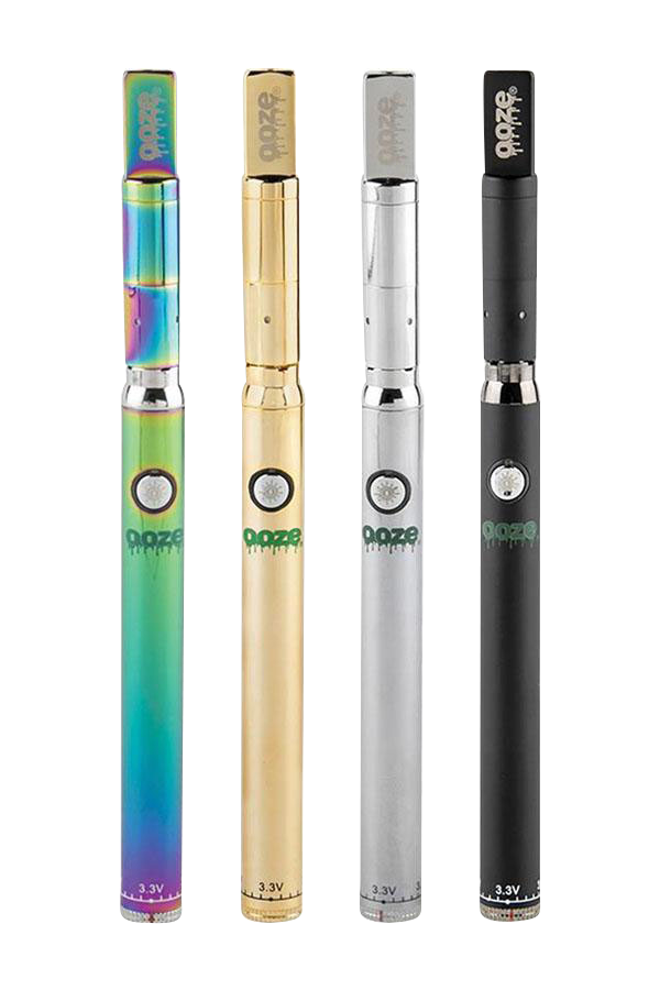 Front-facing row of four colorful Ooze Slim Twist PRO Concentrate Vape Kit pens—iridescent, gold, silver, and matte black—against a white background.