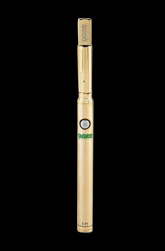 Centered front view of a gold Ooze Slim Twist PRO Concentrate Vape Kit against a black background, showing its button, green logo, and mouthpiece.