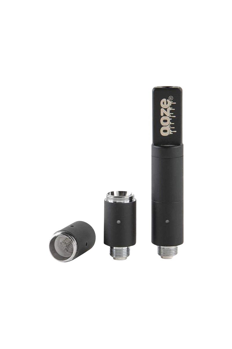 Three-piece close-up of the black Ooze Slim Twist Pro Wax Atomizer Tank shown upright and disassembled on a white background.