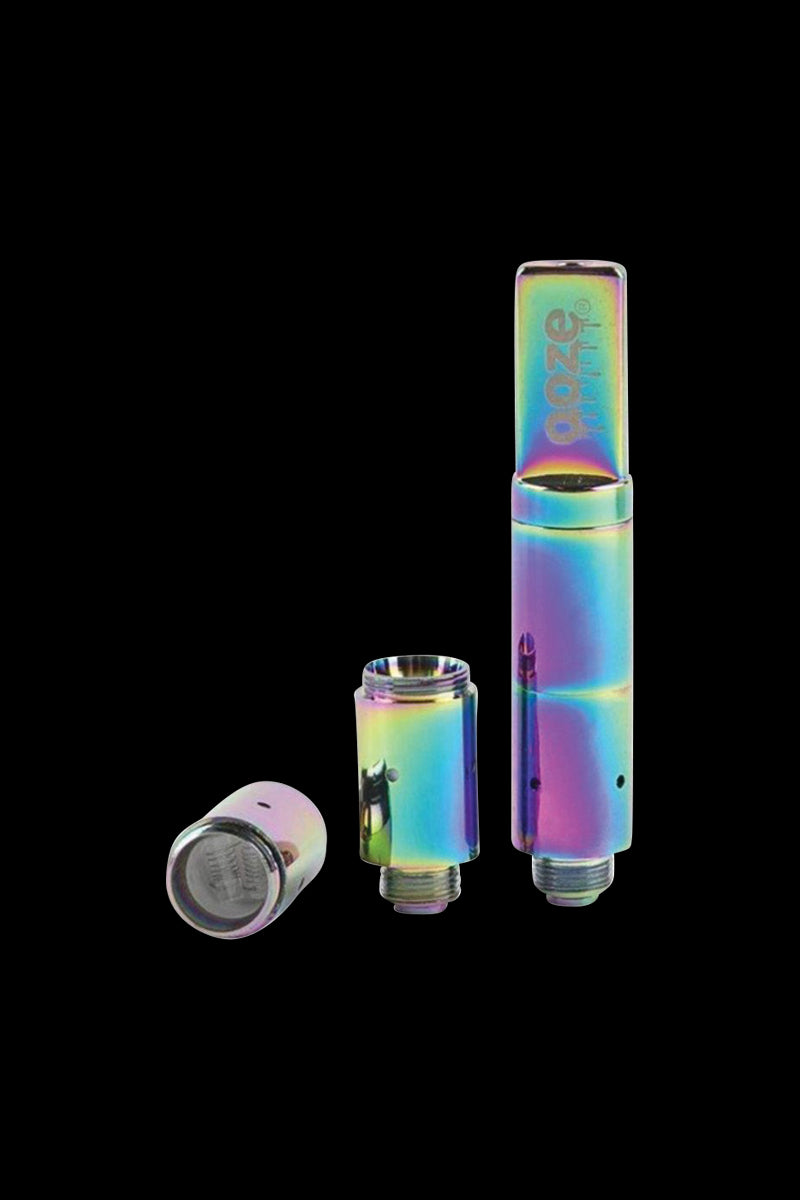 Close-up front view of the iridescent gold Ooze Slim Twist Pro Wax Atomizer Tank disassembled into three metallic pieces against a black background
