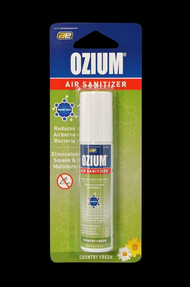Front-facing shot of the Ozium Scented 0.8oz Air Sanitizer in blister pack with green "Country Fresh" background and white cap