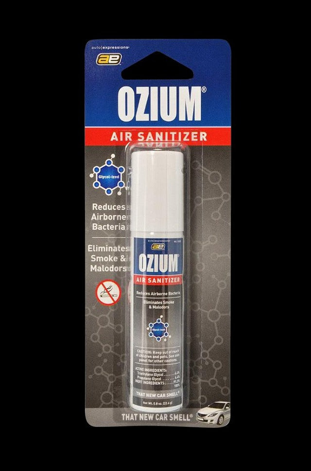 Centered, frontal shot of the Ozium Scented 0.8oz Air Sanitizer in its blue-and-red blister pack against a black background.