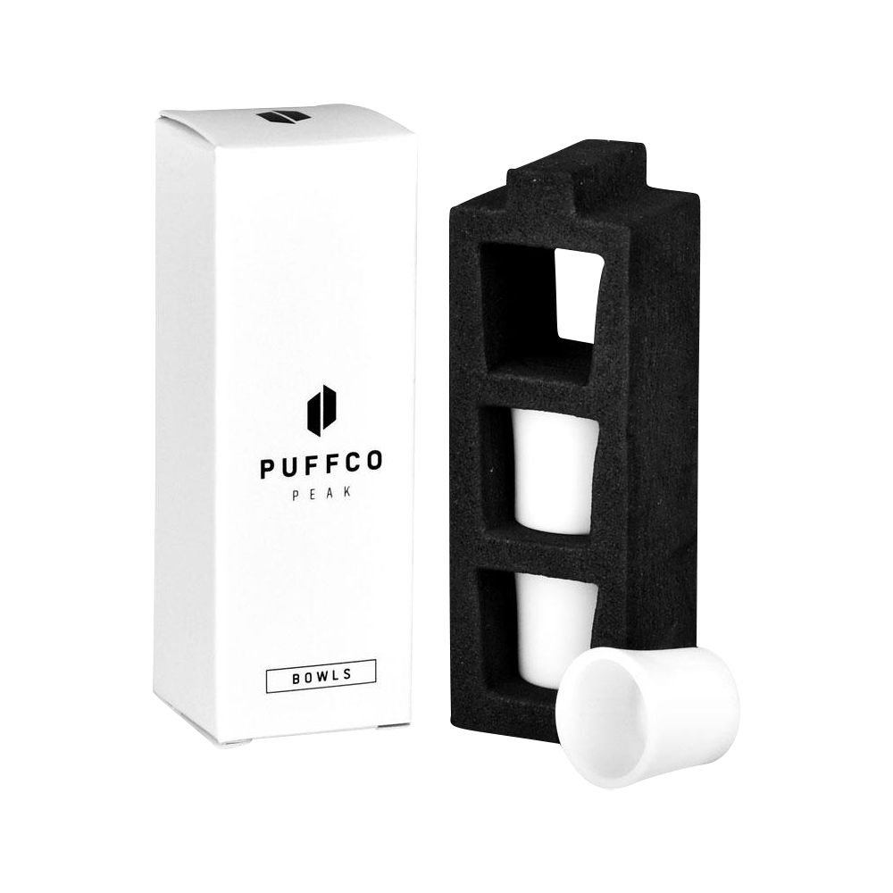 A close-up of the three white Puffco Peak Replacement Ceramic Bowls nestled within a black plastic insert.