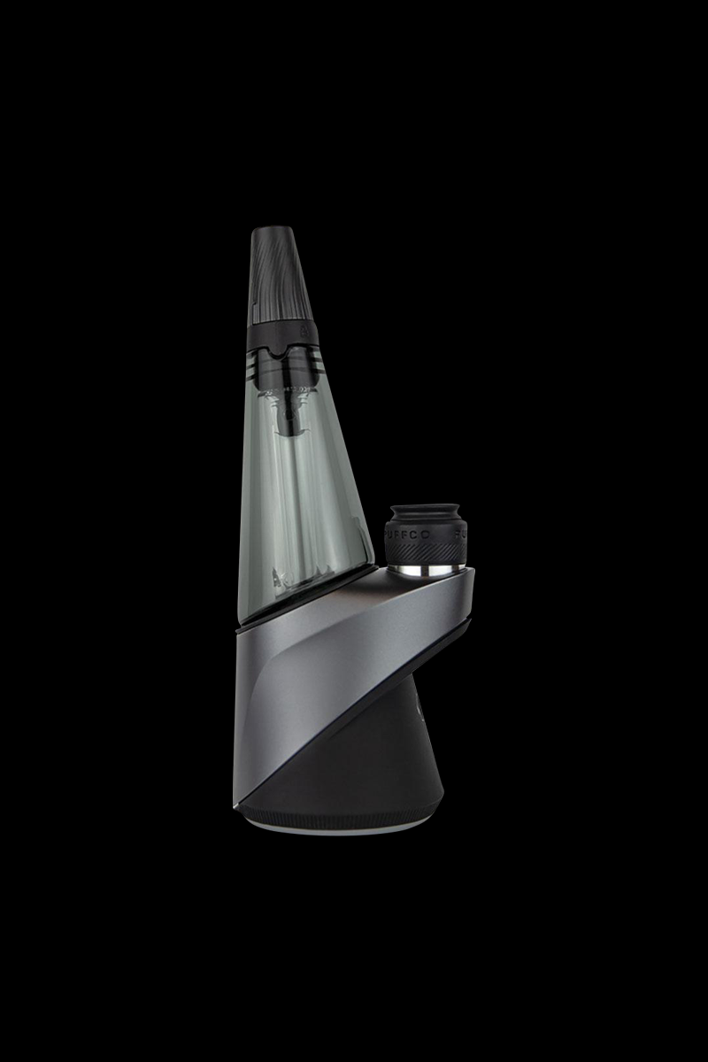 A three-quarter view of the Puffco Travel Glass for Peak & Peak Pro, showing its clear glass construction and sleek, portable design.