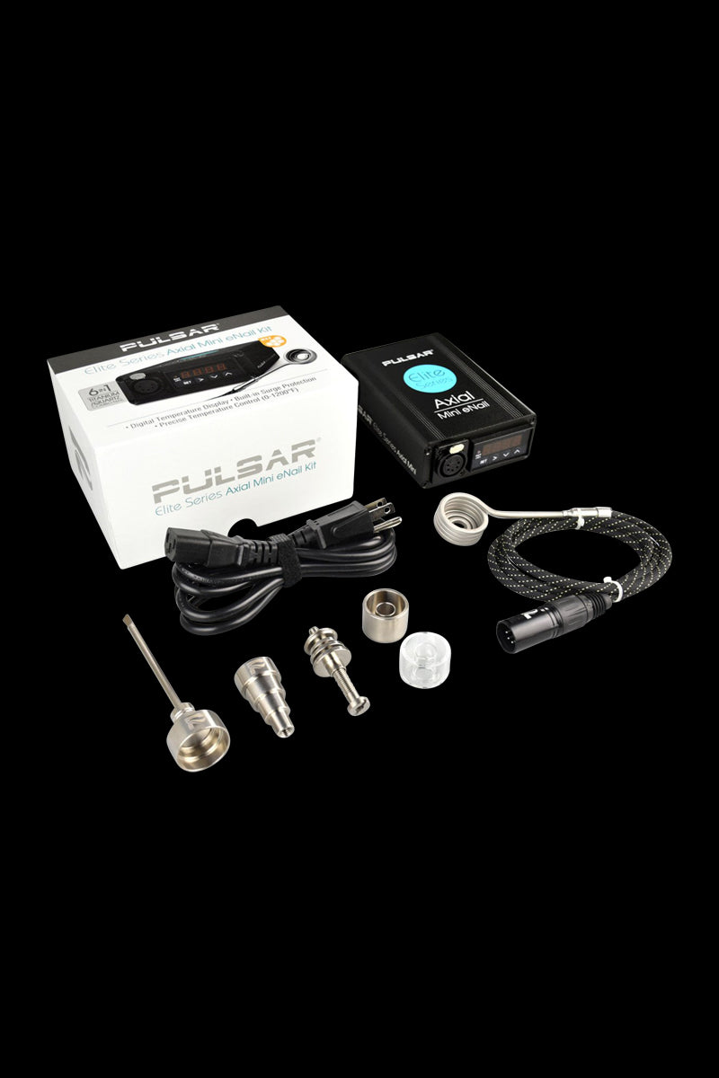 Angled top-down view of the Pulsar Axial Mini eNail Kit laid out on a black background, showing the black controller, white branded box, braided cable, power cord, and metal fittings.