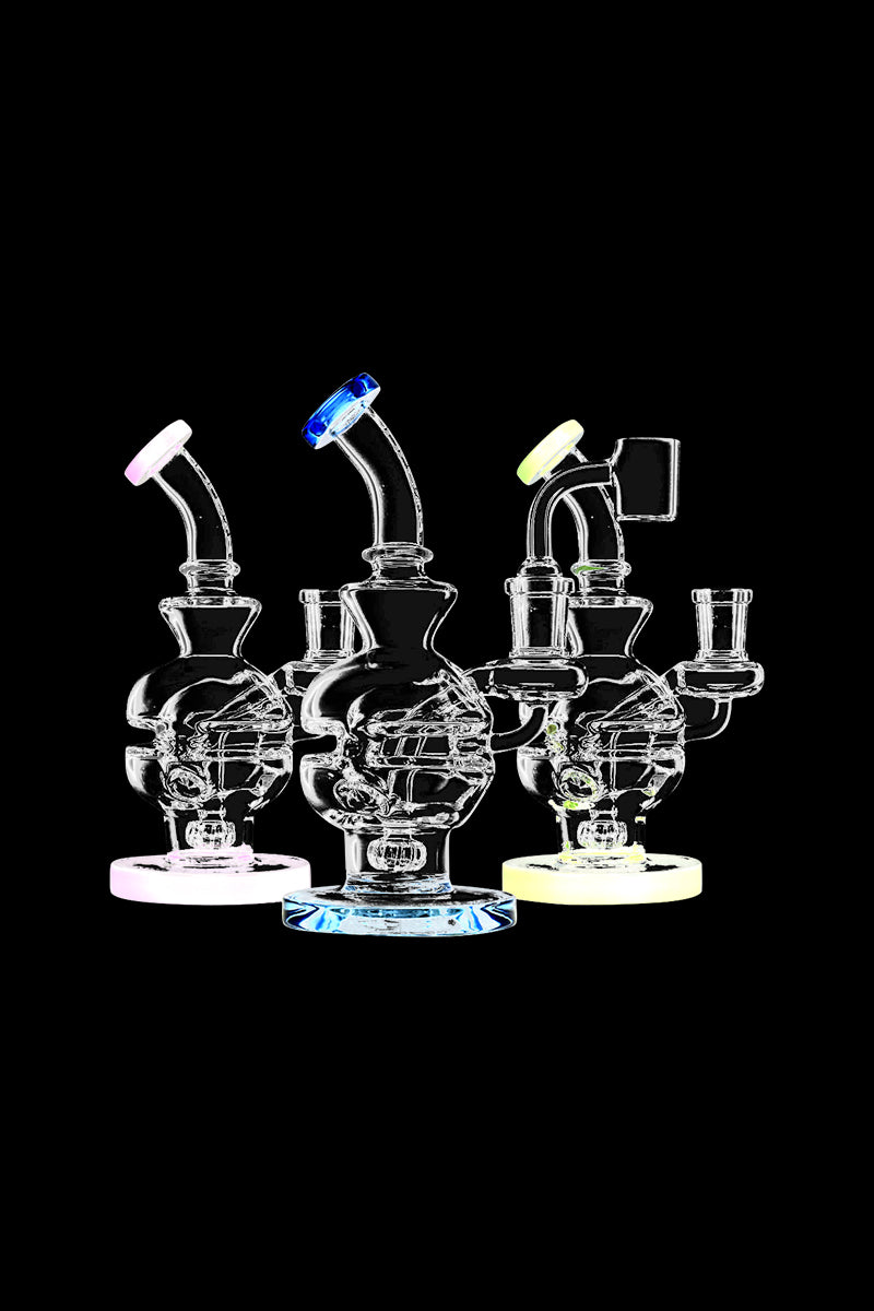 A studio shot displays the Pulsar Mini Egg Dab Rig, showcasing its compact size and clear glass construction from a slightly angled perspective.