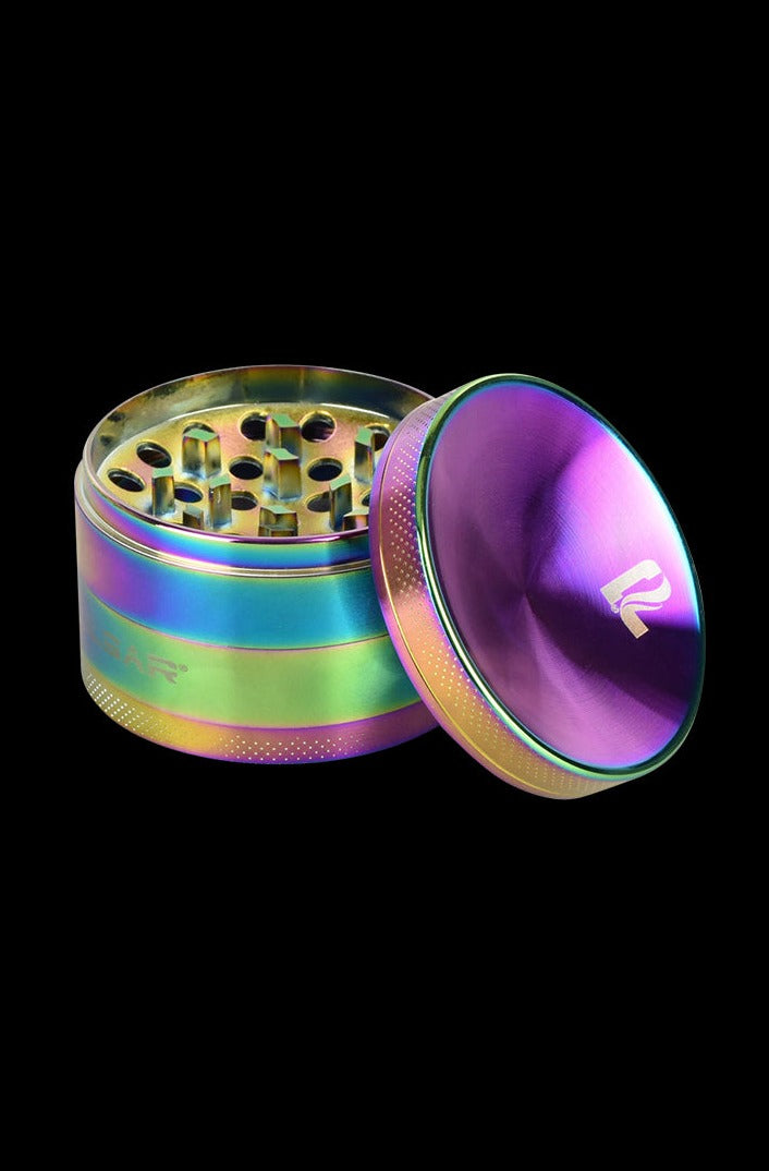 A close-up, angled view of the open Pulsar Concave Rainbow Anodized Aluminum Grinder, showcasing its colorful, multi-tiered design.