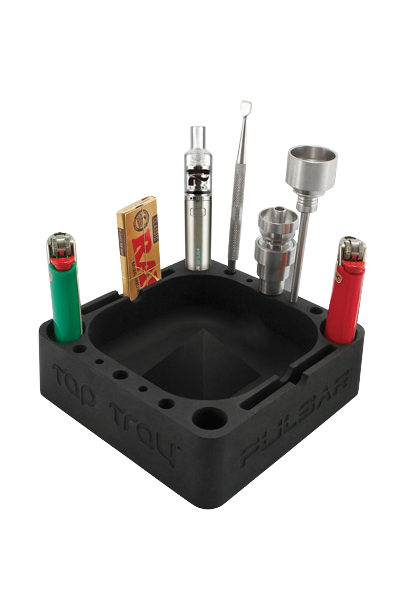 Angled top view of the black Pulsar Tap Tray holding lighters, a small vape pen, rolling papers and metal tools in its recessed square center.