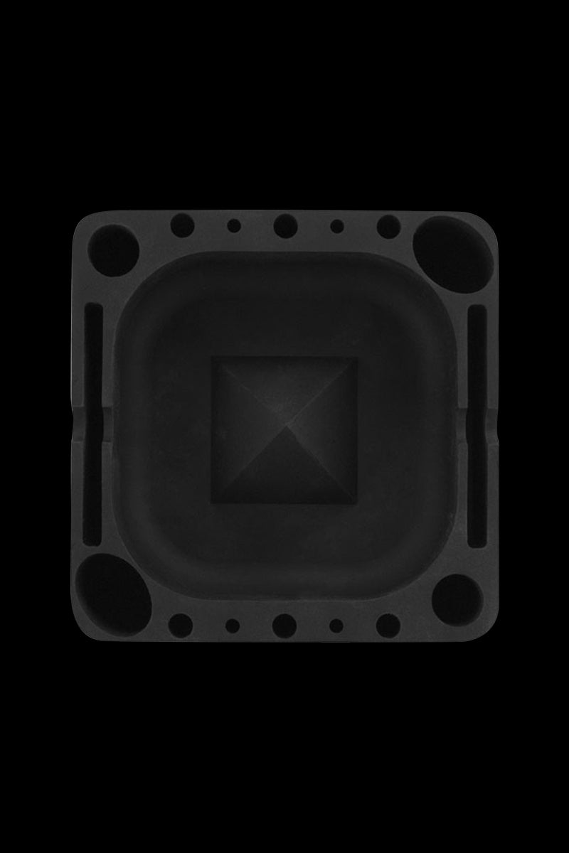 Top-down view of the black Pulsar Tap Tray showing its square recessed center, corner wells, and evenly spaced circular tool holes.