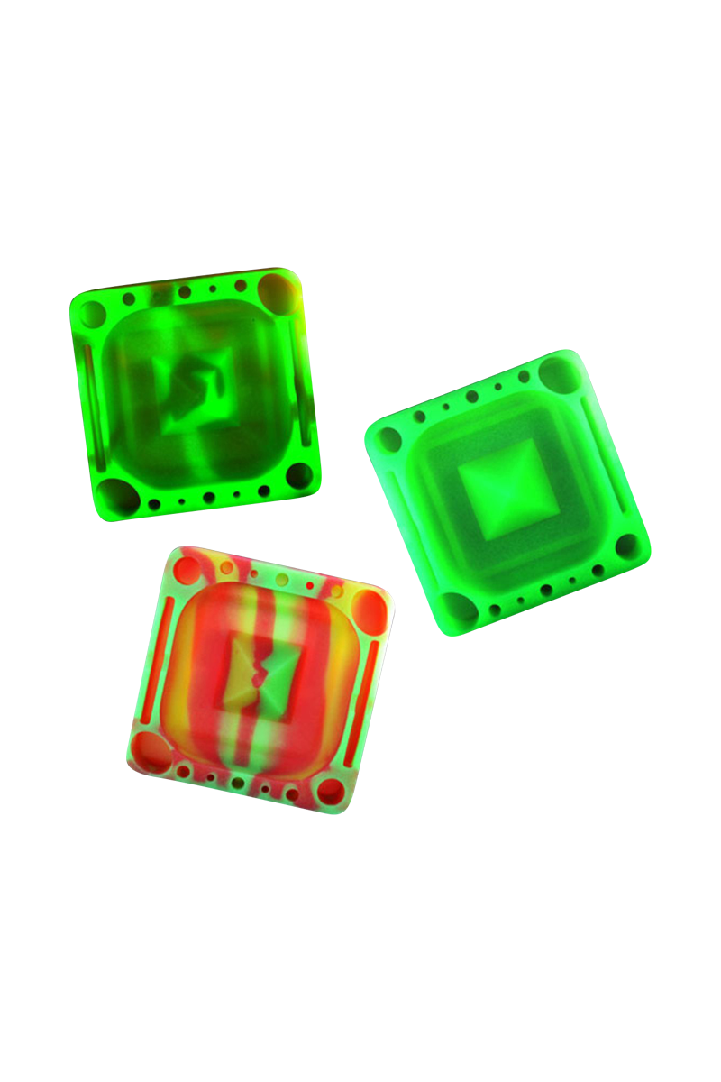 Three overhead angled Pulsar Tap Tray silicone trays in neon green and one red-striped variant arranged on a white background.