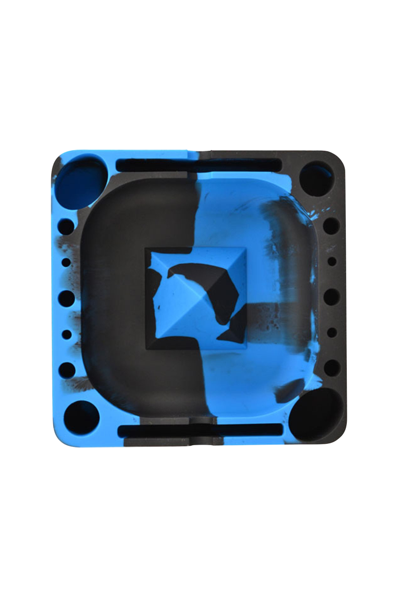 Top-down view of a square, blue-and-black marbled Pulsar Tap Tray showing rounded compartments, a central raised pyramid, and multiple circular slots.