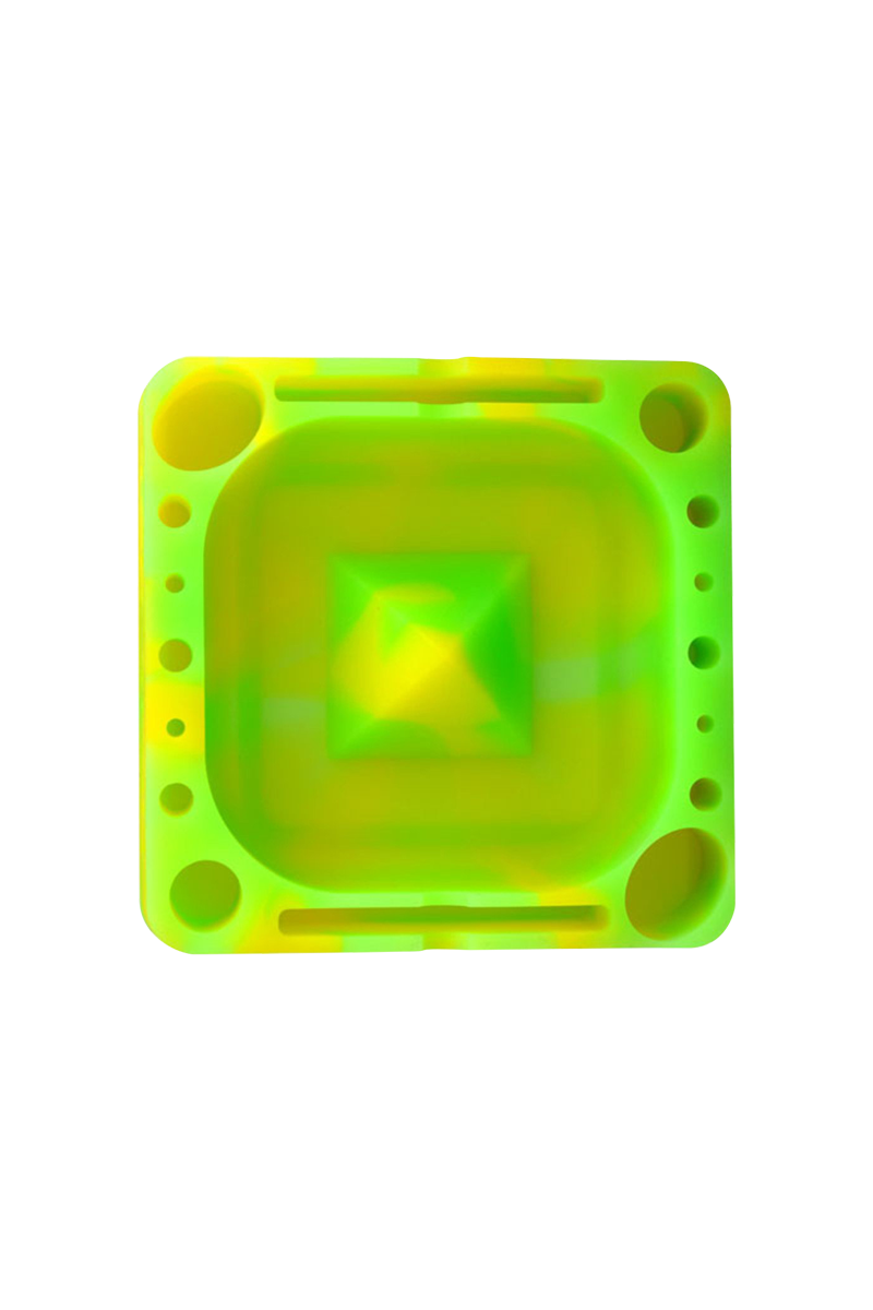 Top-down view of a neon green and yellow Pulsar Tap Tray showing its square recessed center, raised pyramid hub, and multiple circular and slot compartments.
