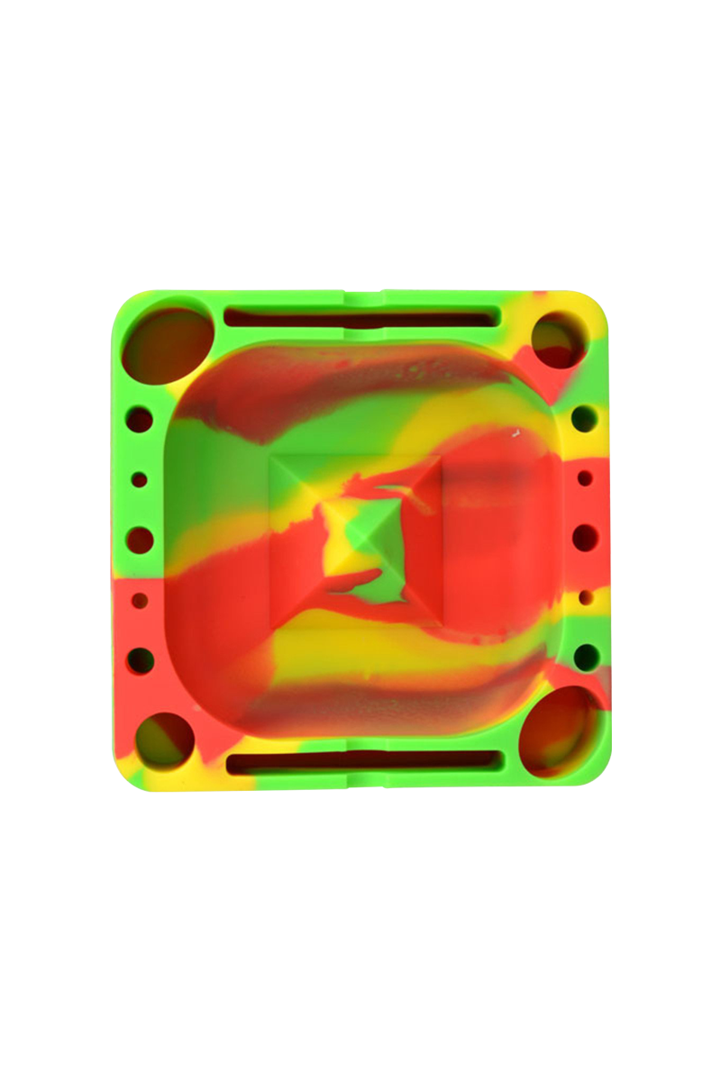 Top-down view of a red, yellow, and green swirled Pulsar Tap Tray with multiple round wells and rectangular slots.