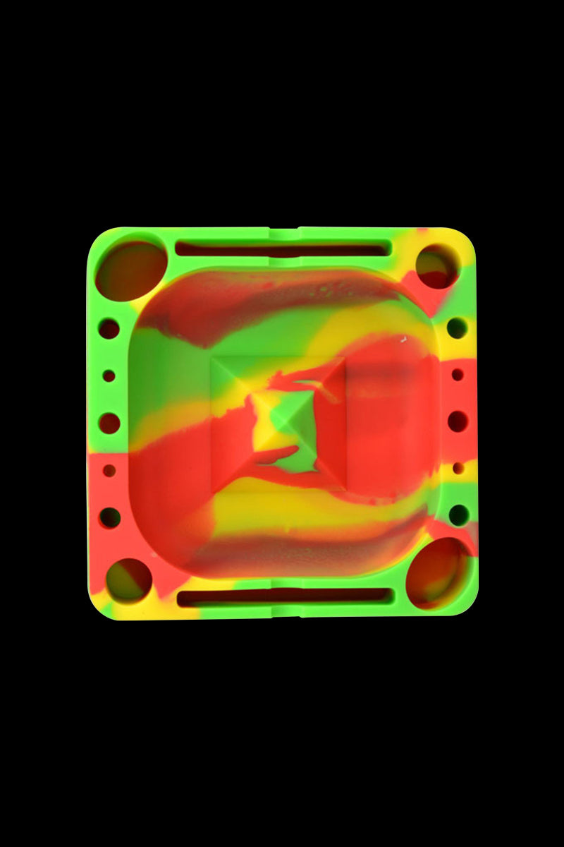 Top-down view of a green-yellow marbled Pulsar Tap Tray with rounded square shape, built-in compartments and circular wells.