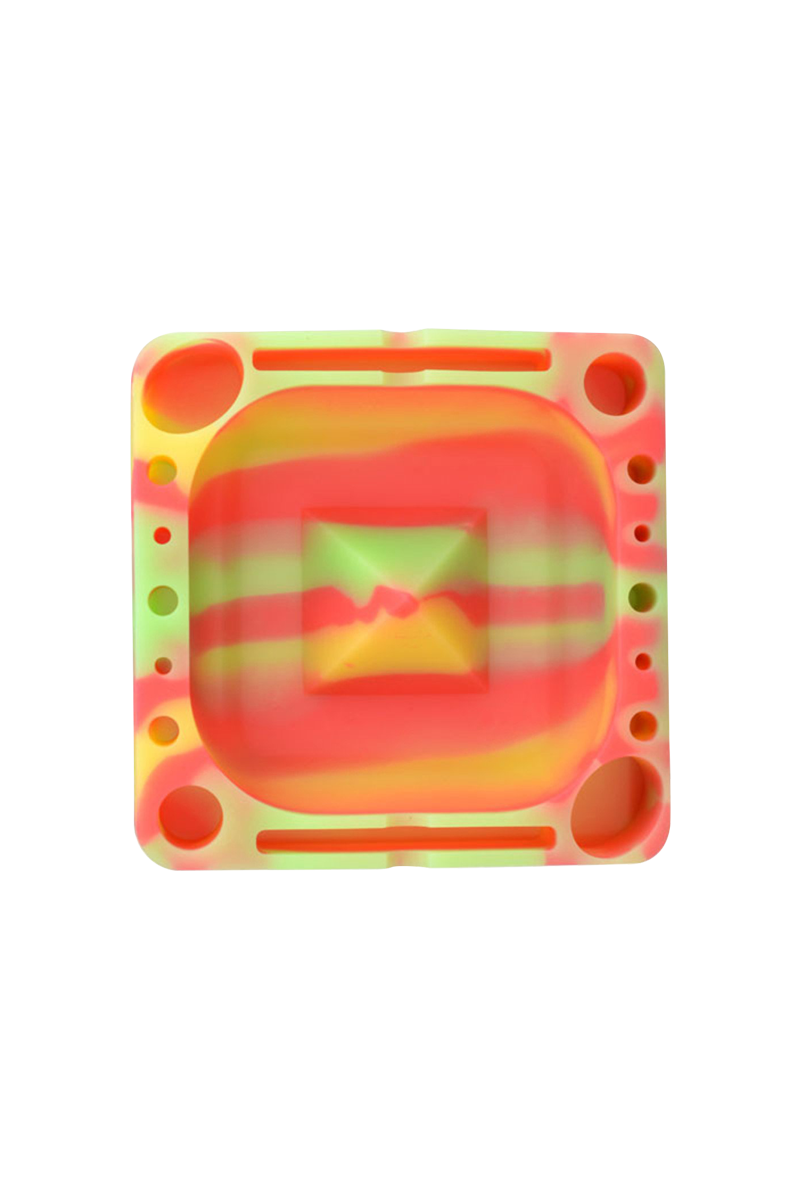 Top-down view of a neon swirl silicone tray, the Pulsar Tap Tray showing square center well and multiple round and slot compartments.