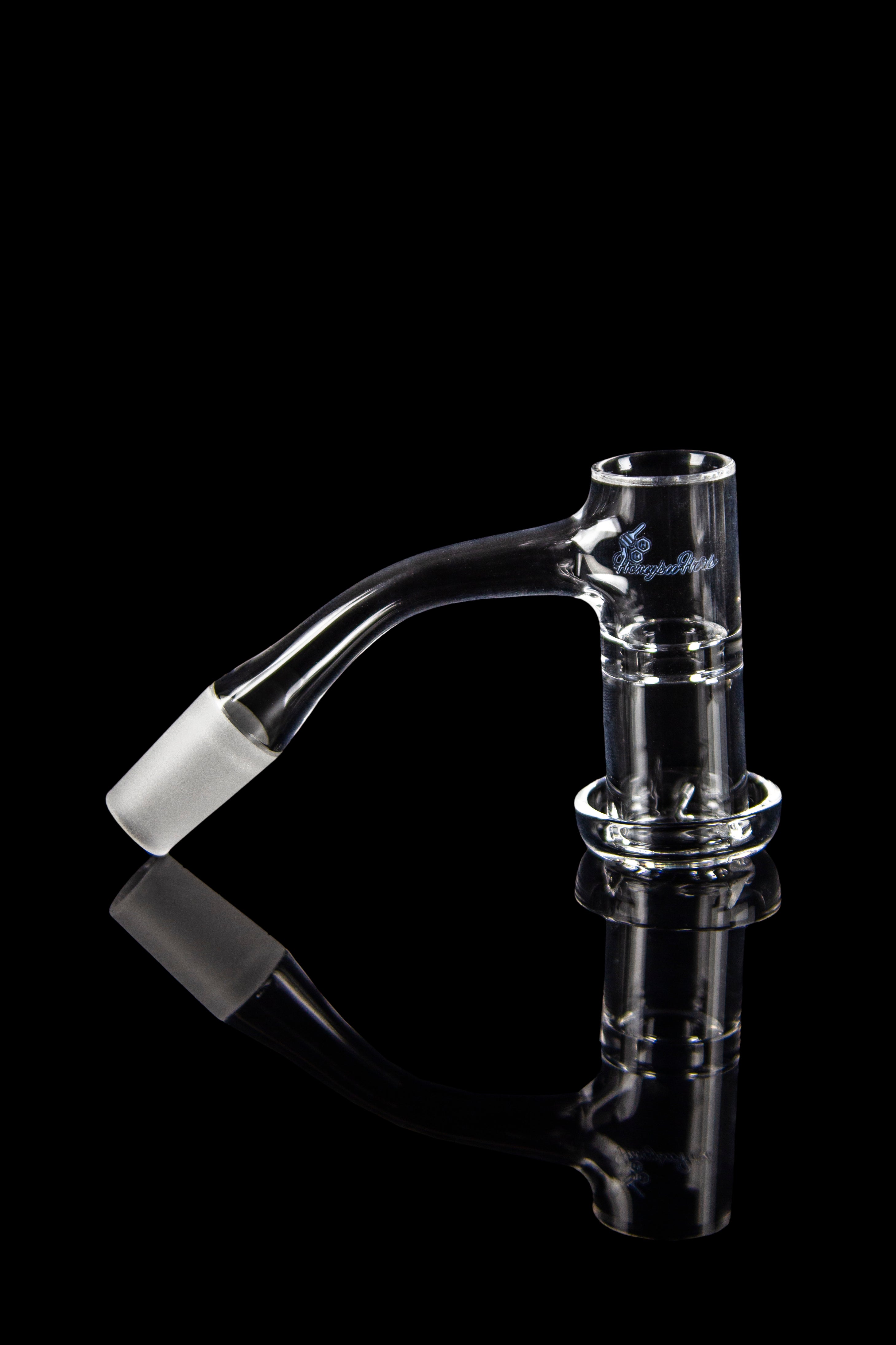 Clear glass dab rig nail with reflective surface.