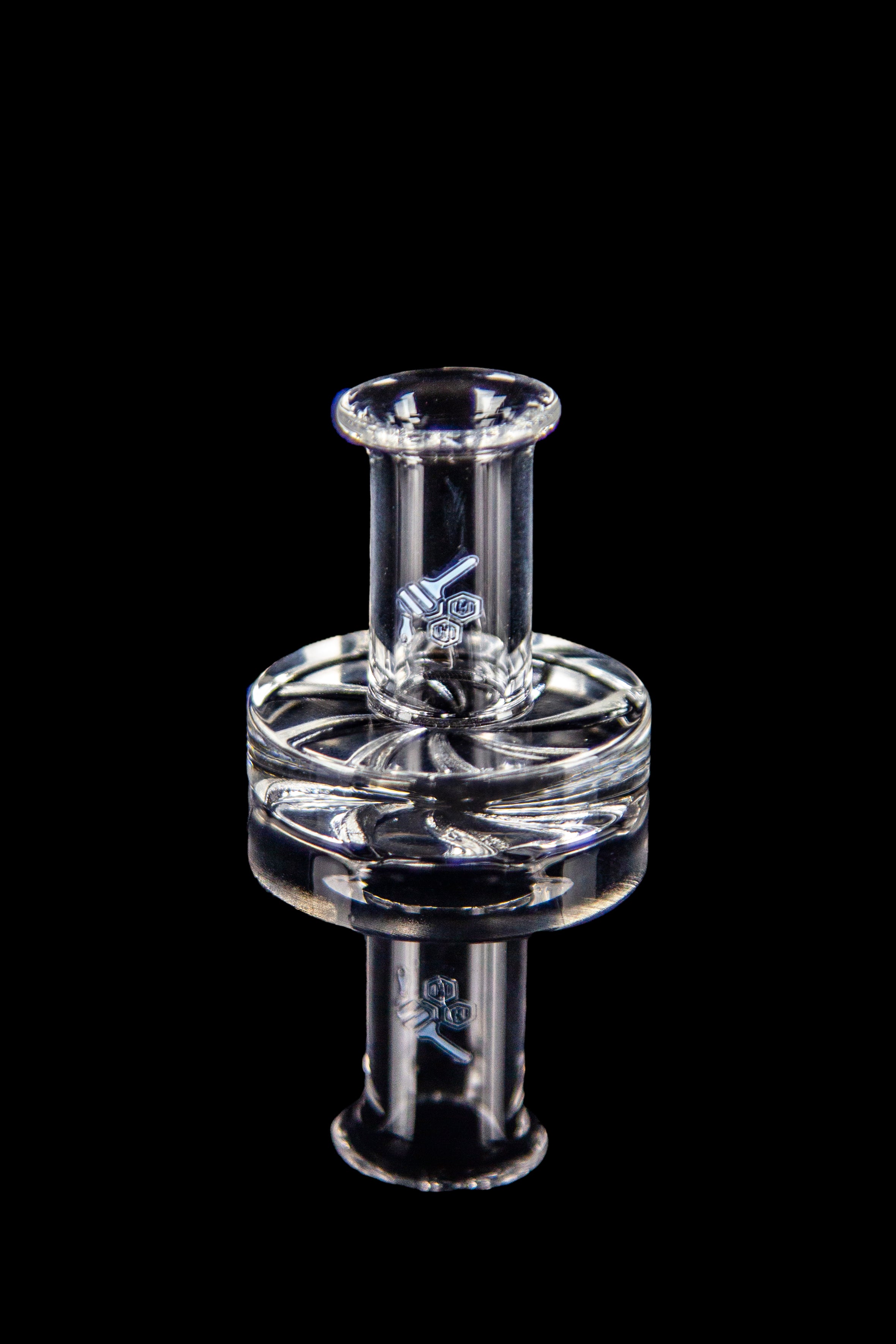 Clear glass dab rig with intricate design against a black background.