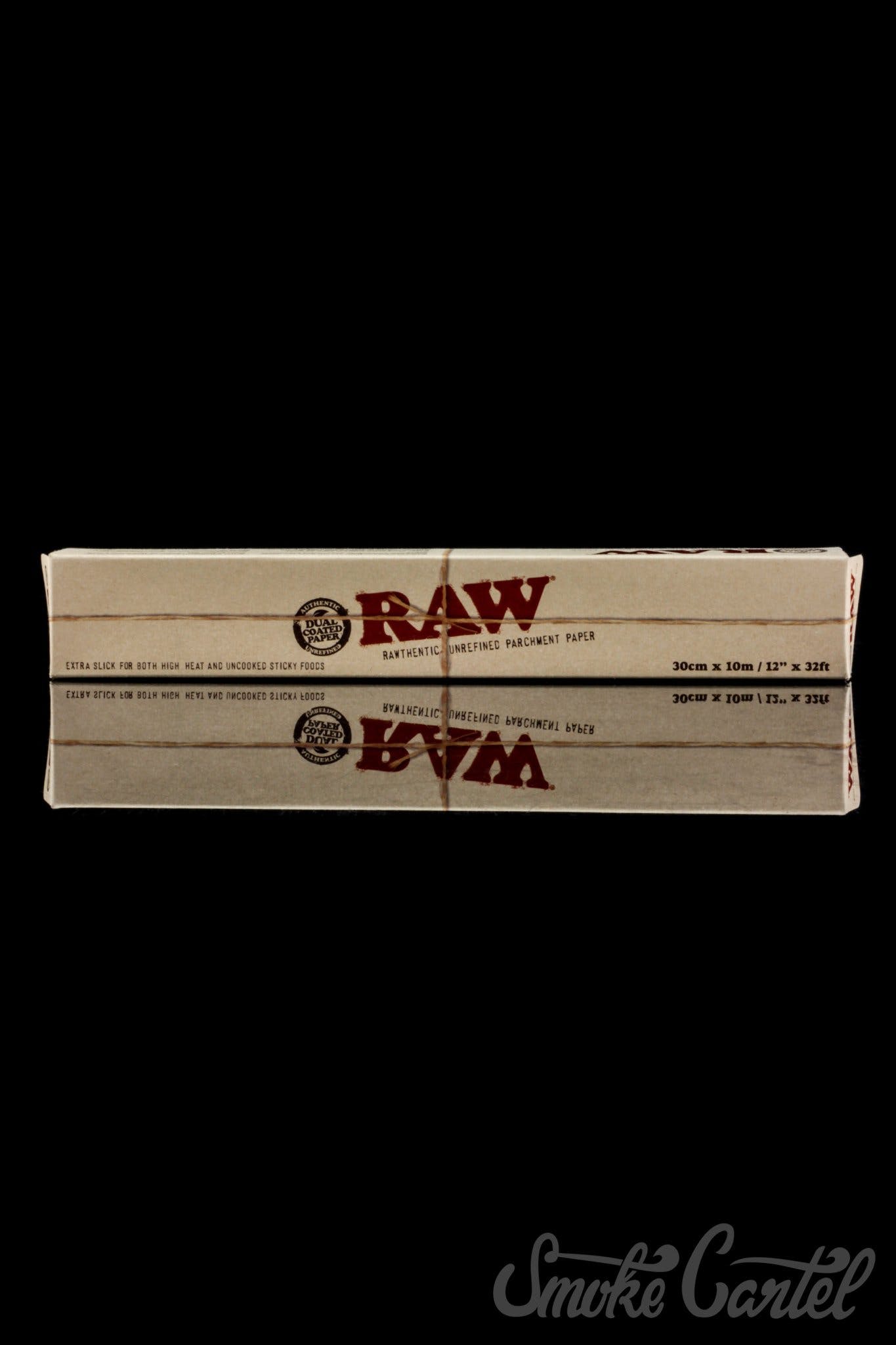 RAW Parchment Paper rests on a dark surface, photographed from a slightly elevated angle with simple, clean composition.