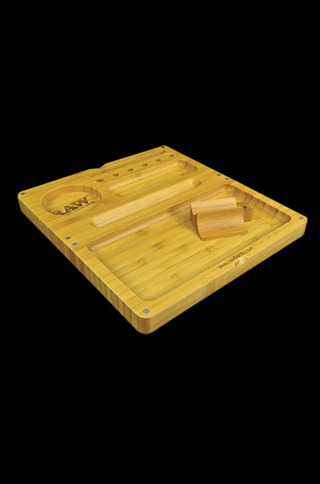An overhead view of the RAW Backflip Magnetic Bamboo Rolling Tray, displaying its natural wood grain and magnetic components.