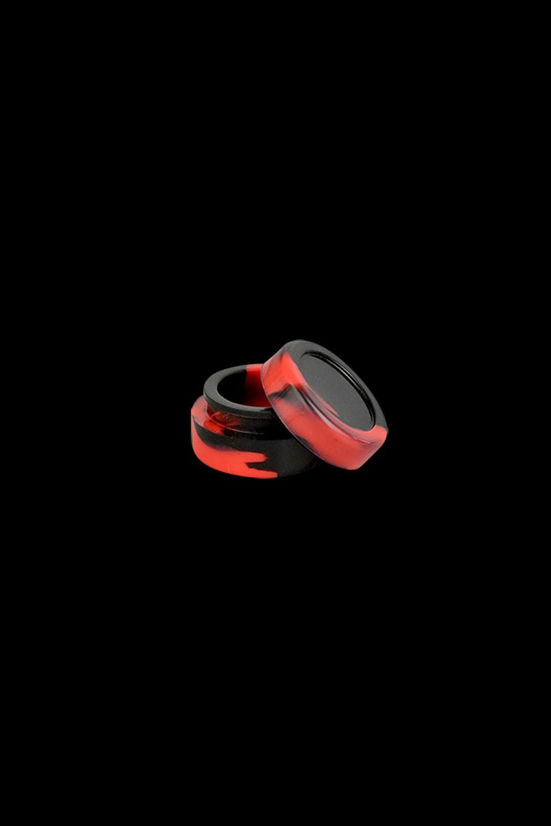 Close-up of a small red-and-black silicone Reclaimer Dab Straw set, two stacked pieces shown on a black background.