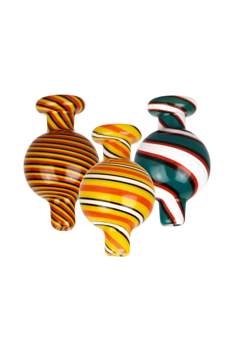 A close-up, angled view of the Reverse Color Glass Ball Carb Cap, showcasing its swirling, colorful glass design against a plain white background.