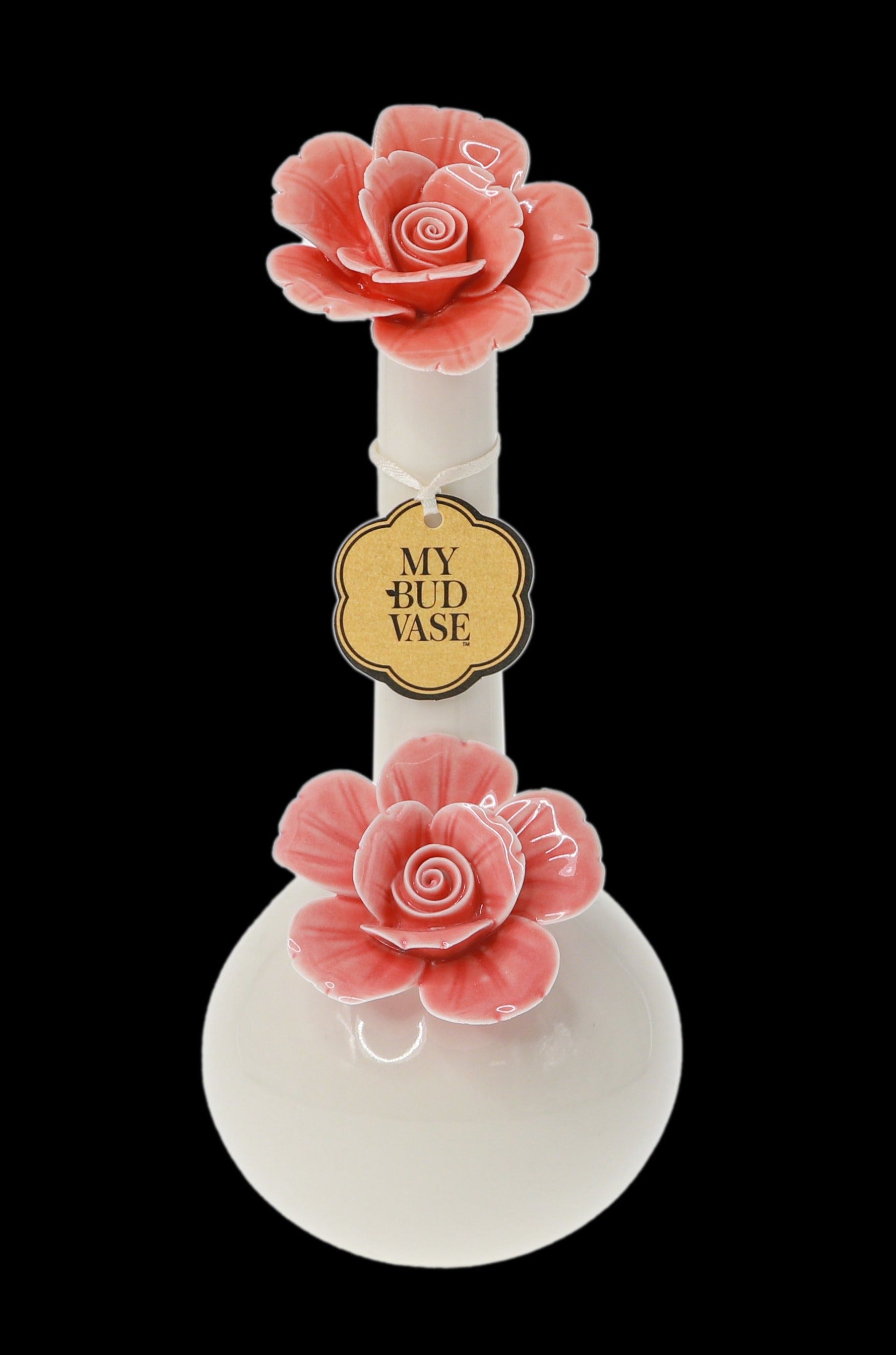 A glass bubbler decorated with peach-colored roses and labeled “My Bud Vase” against a black background. <start_of_image>