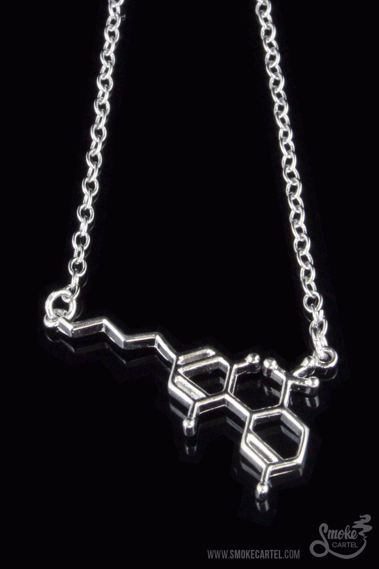 Close-up of the Smoke Cartel THC Molecule Bracelet, a silver-toned chain with a molecular structure pendant against a dark background.