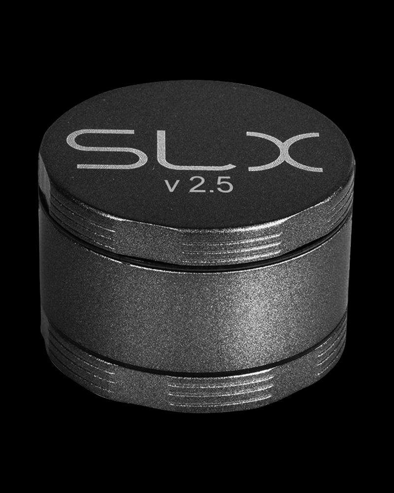 A close-up, angled view of the SLX Ceramic Coated 2.5" Medium Grinder, showcasing its metallic, multi-tiered construction.