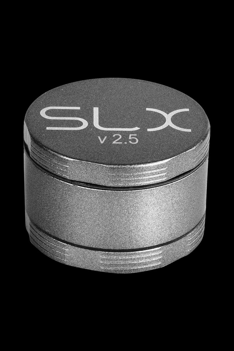 Front view of the SLX Ceramic Coated 2.5" Medium Grinder, showing a metallic, cylindrical shape with textured layers.