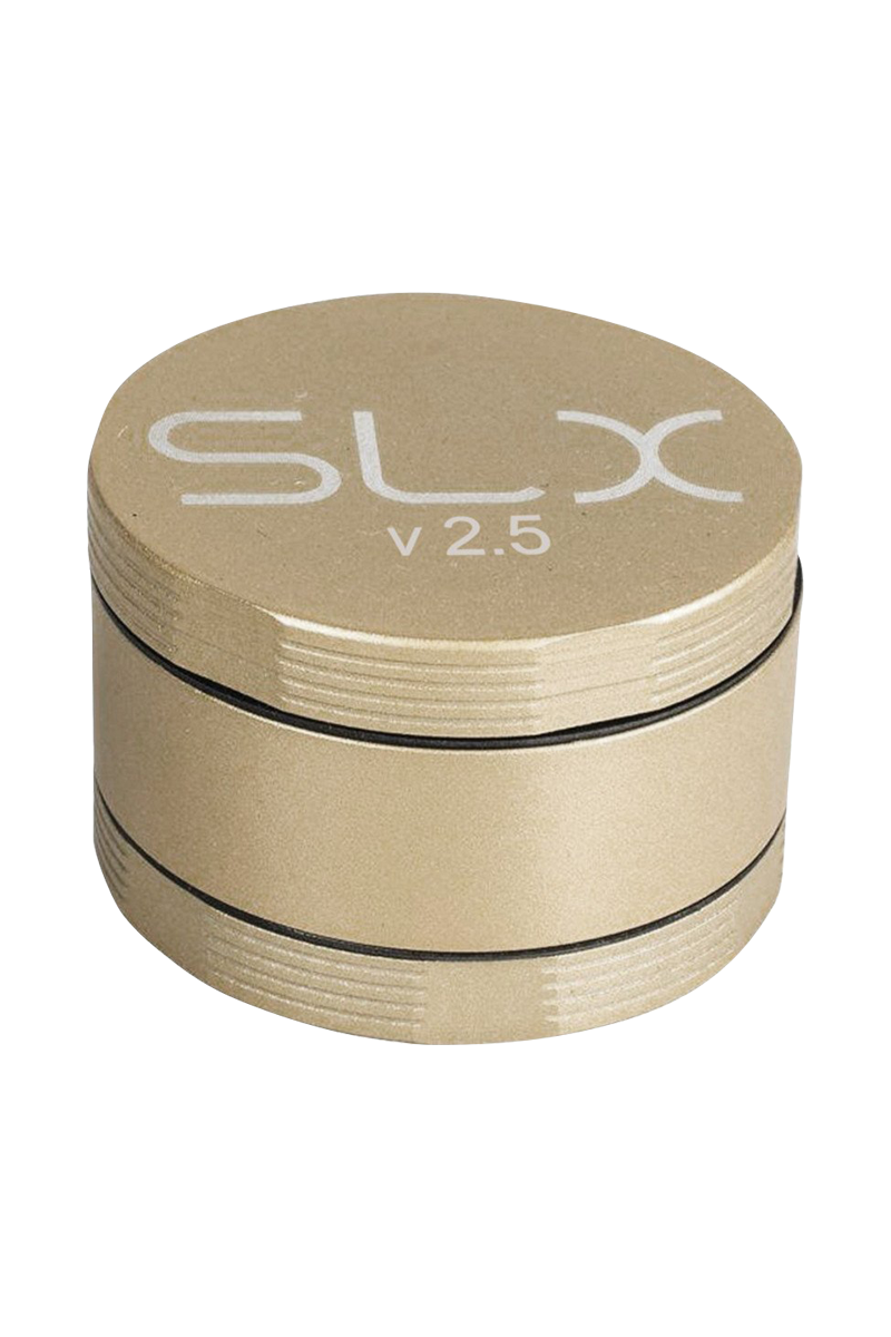 A close-up, angled view of the SLX Ceramic Coated 2.5" Medium Grinder, showcasing its metallic finish and circular design.