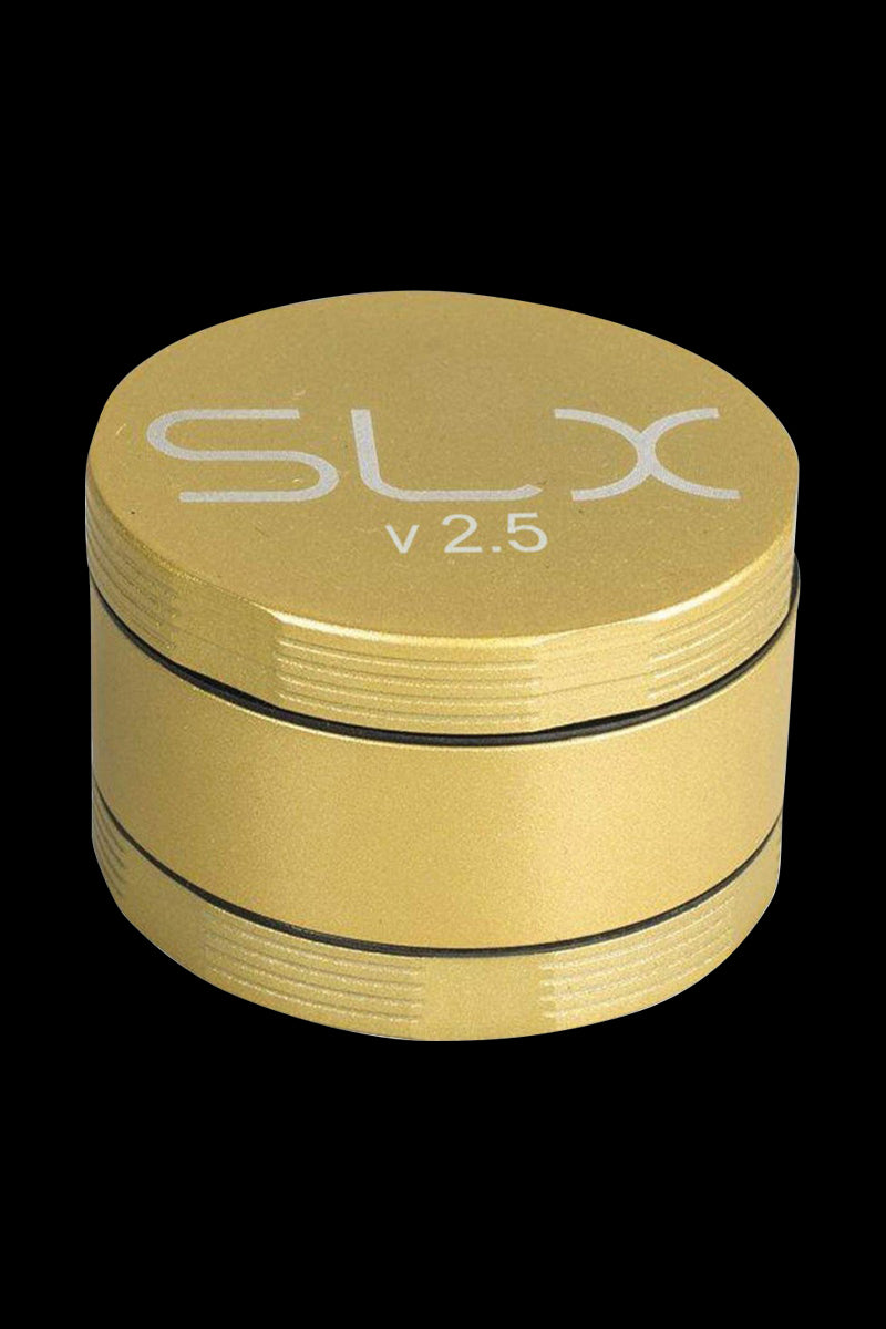 A close-up of the SLX Ceramic Coated 2.5" Medium Grinder, showing its metallic finish and cylindrical shape against a dark backdrop.