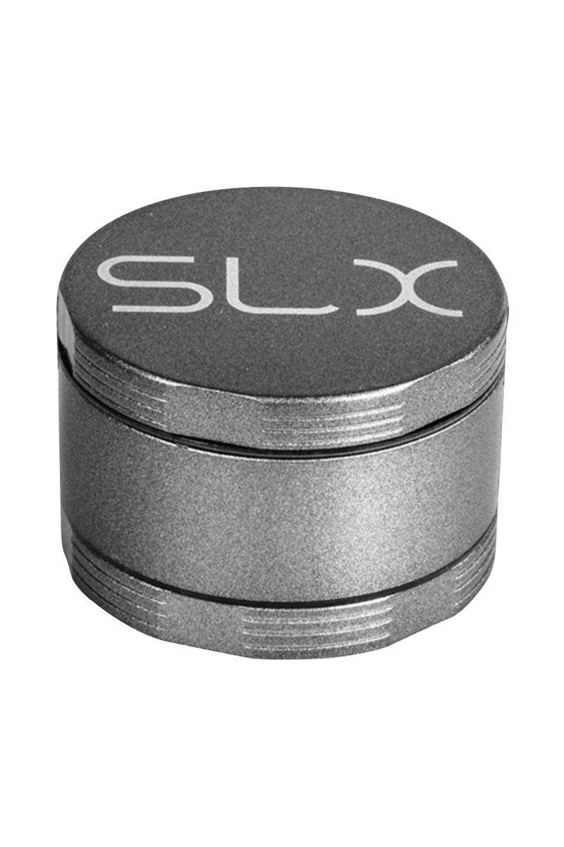 Angled close-up of the metallic SLX Ceramic Coated 2.2" Pocket Grinder showing its textured lid with "SLX" logo and threaded midsection.