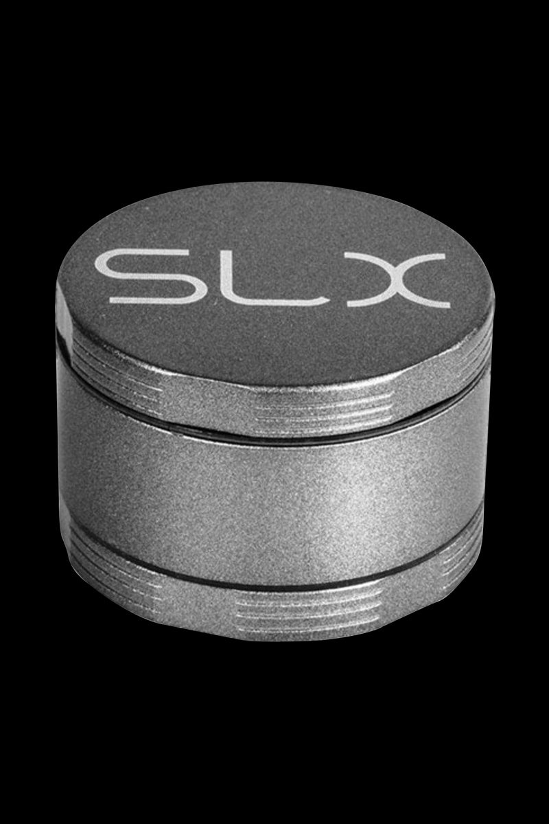 Close-up front angle of the charcoal SLX Ceramic Coated 2.2" Pocket Grinder showing its textured lid with white SLX logo.