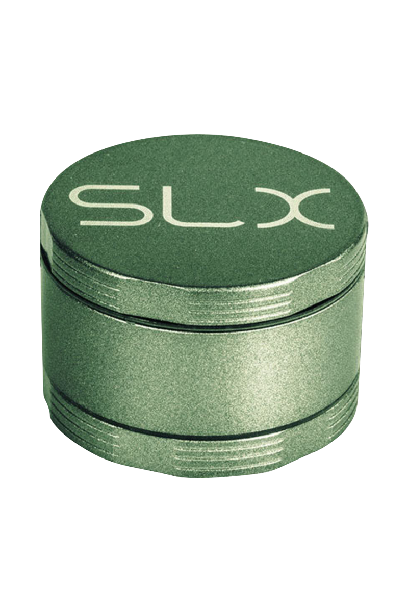 Angled top-down view of the green SLX Ceramic Coated 2.2" Pocket Grinder showing its textured lid with white SLX logo and stacked metal chambers.