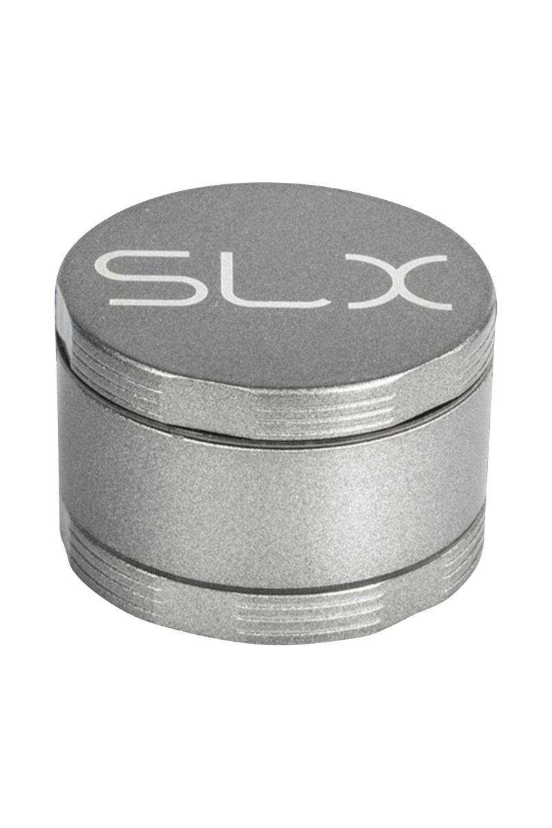 Close-up three-quarter view of the silver SLX Ceramic Coated 2.2" Pocket Grinder showing its textured lid with large "SLX" logo and stacked screw-threaded layers.
