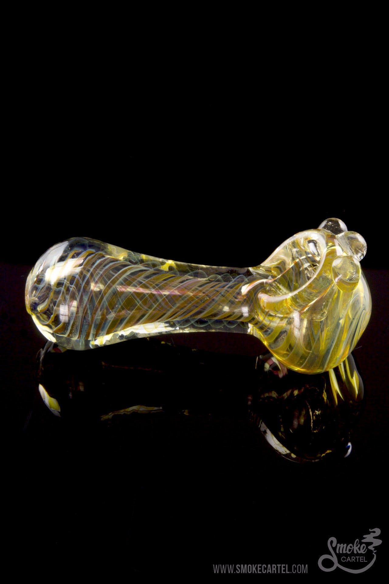 Front view of the Gold Fumed Spoon Pipe - Midas, showcasing its curved shape and gold fume accents against a dark background.
