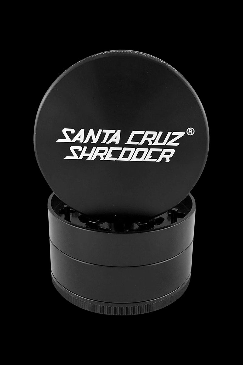 A close-up, top-down view of the Santa Cruz Shredder Grinder – Large, showing its cylindrical, multi-part metal construction.